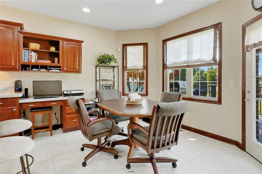 710 Governors Road Troy, OH 45373 - Photo 9 of 56 This bright and functional eat-in kitchen features ample cabinetry and a convenient desk area.