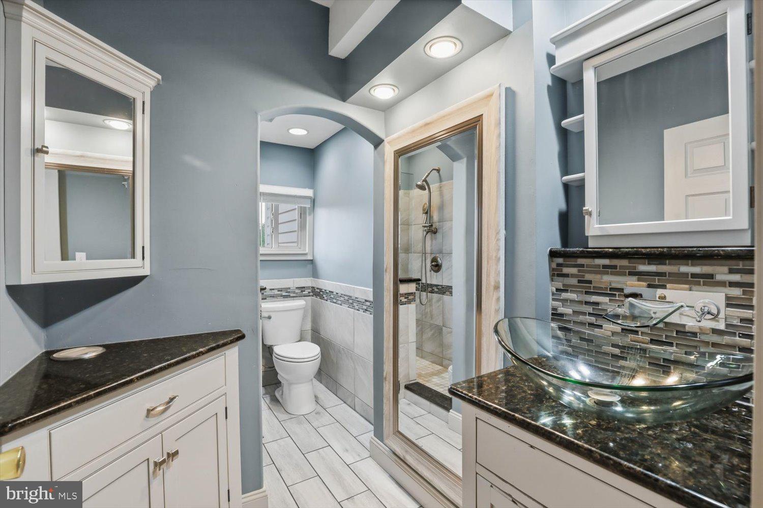 135 South Cedar Street Lititz, PA 17543 - Photo 26 of 52 a bathroom with a granite countertop sink and a mirror
