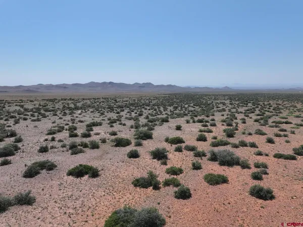 a view of a town with mountains in the background