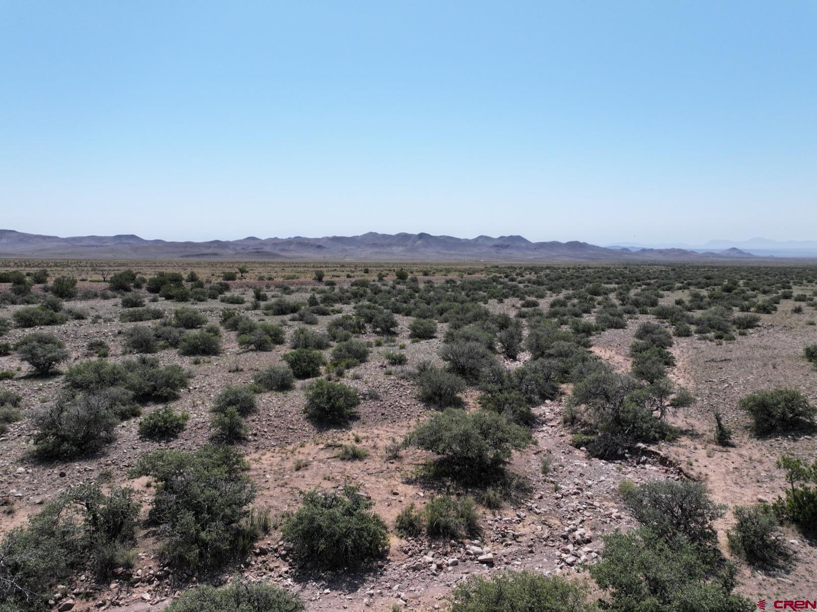 0 Cienega Camp Road Magdalena, NM 87825 - Photo 5 of 16 a view of a town with mountains in the background