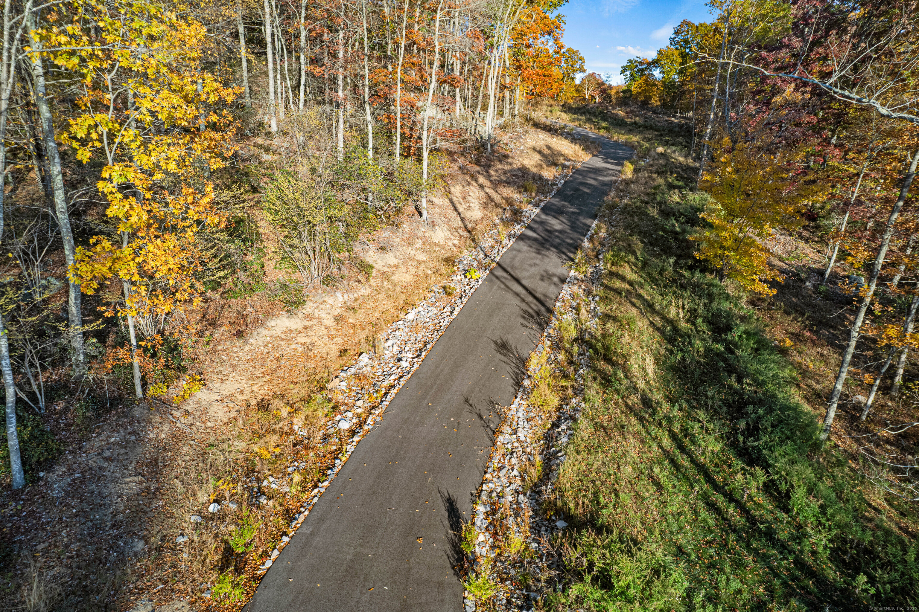 29 Rocco Drive East Lyme, CT 06333 - Photo 12 of 12 a view of a yard with flower plants