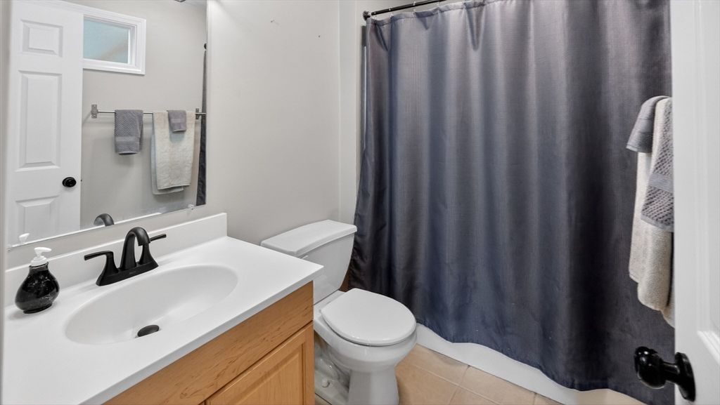 5 Governors Way, Unit B Milford, MA 01757 - Photo 34 of 42 a bathroom with a sink and a toilet