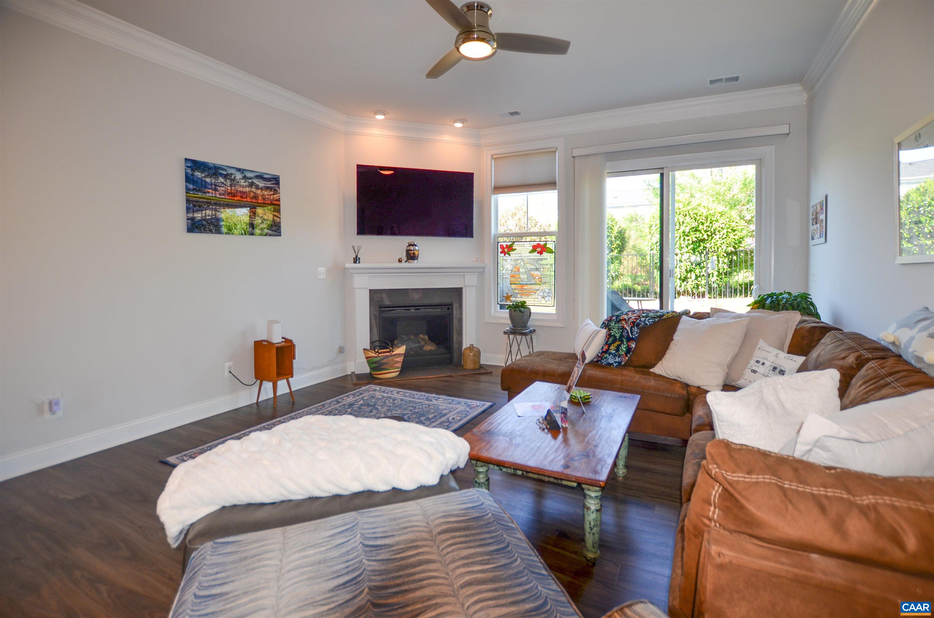 327 Claibourne Road Crozet, VA 22932 - Photo 17 of 36 a bed room with a bed a fireplace and a television