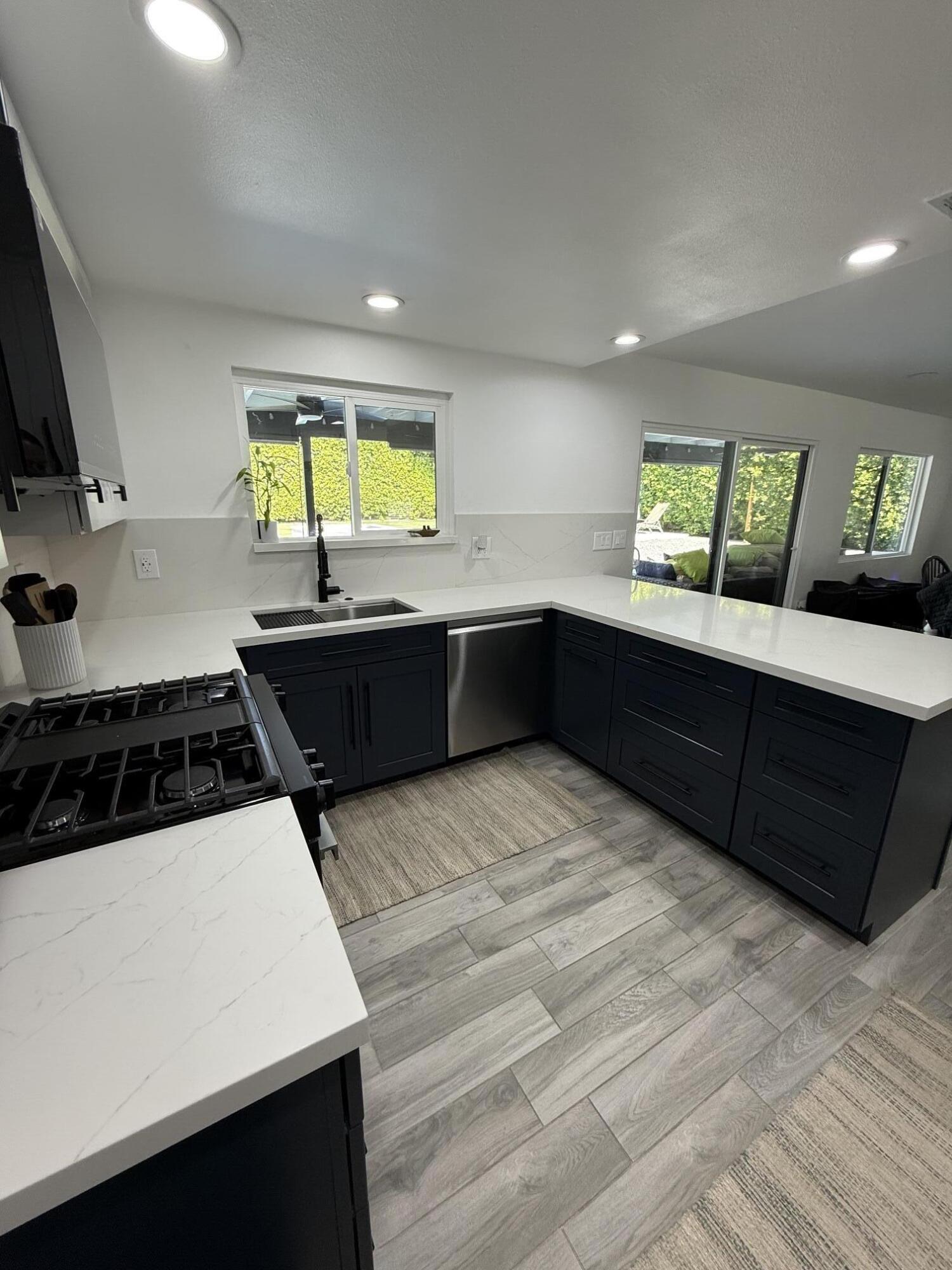 37081 Palmdale Road Rancho Mirage, CA 92270 - Photo 21 of 46 a kitchen with stainless steel appliances granite countertop a sink and a stove