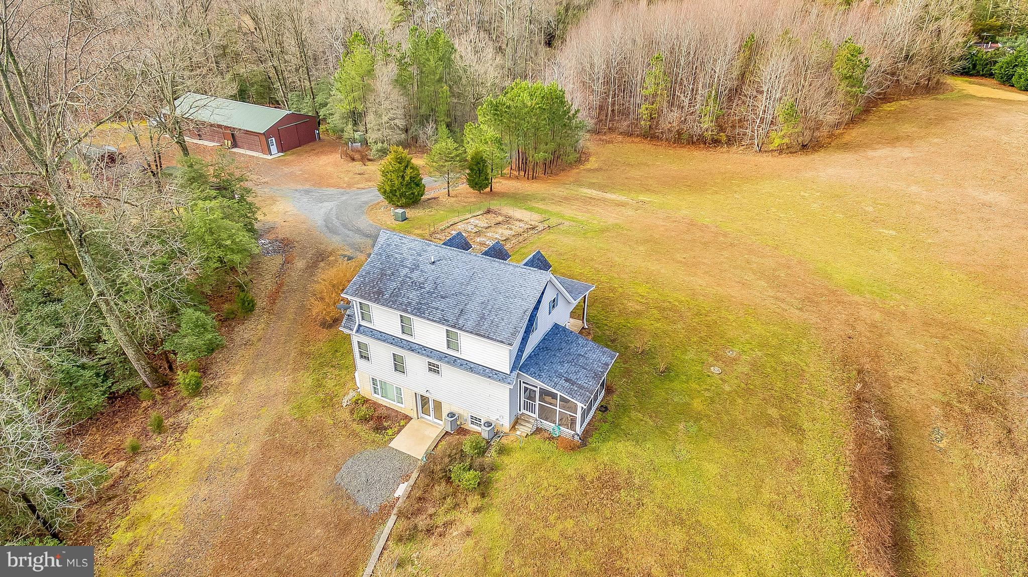 10120 Mackall Road St. Leonard, MD 20685 - Photo 2 of 29 a aerial view of a house with swimming pool