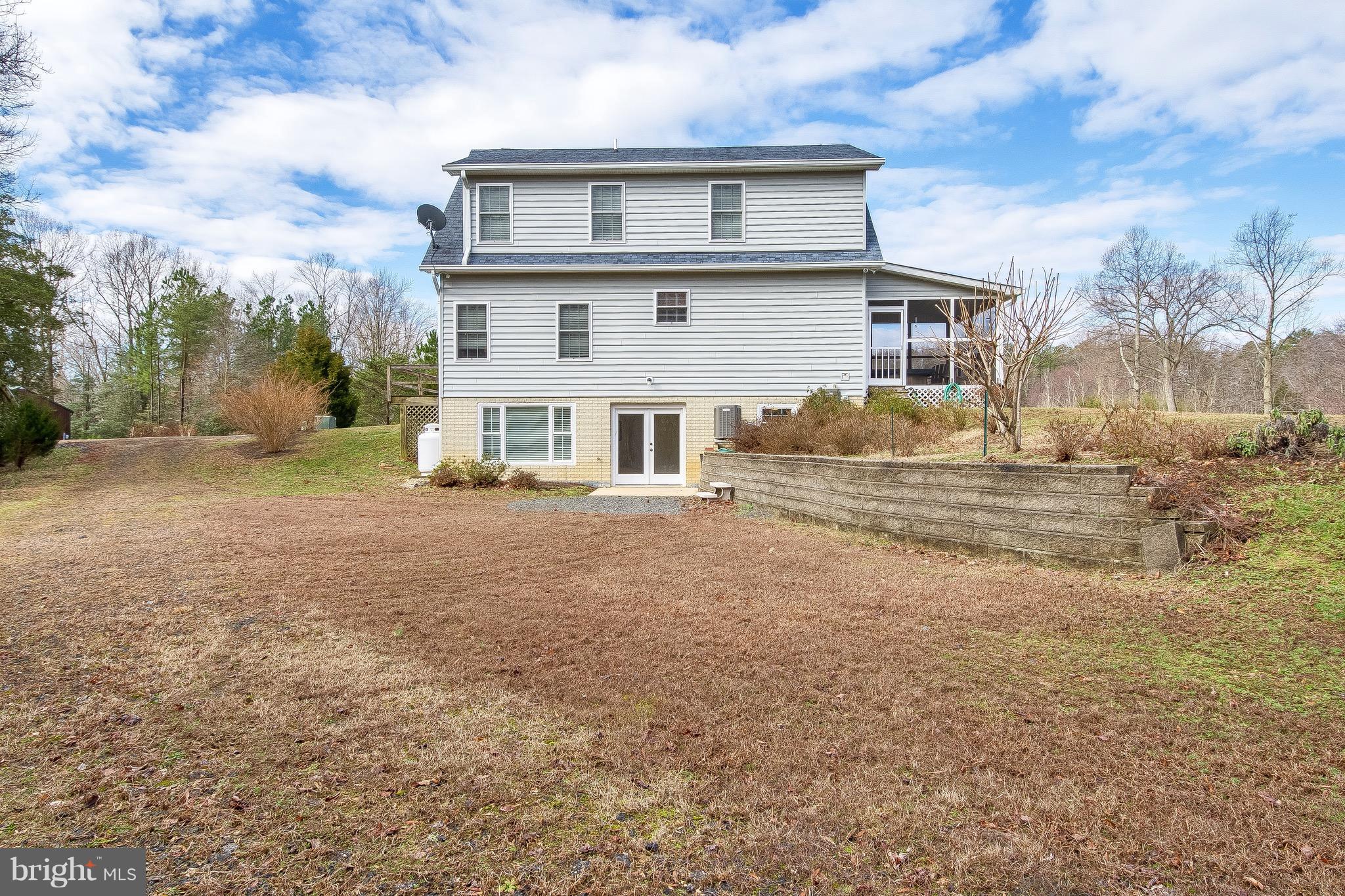 10120 Mackall Road St. Leonard, MD 20685 - Photo 11 of 29 a front view of a house with a yard