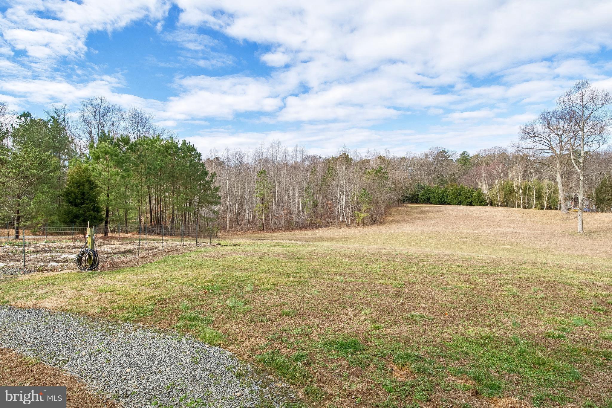 10120 Mackall Road St. Leonard, MD 20685 - Photo 18 of 29 a view of an outdoor space and a yard