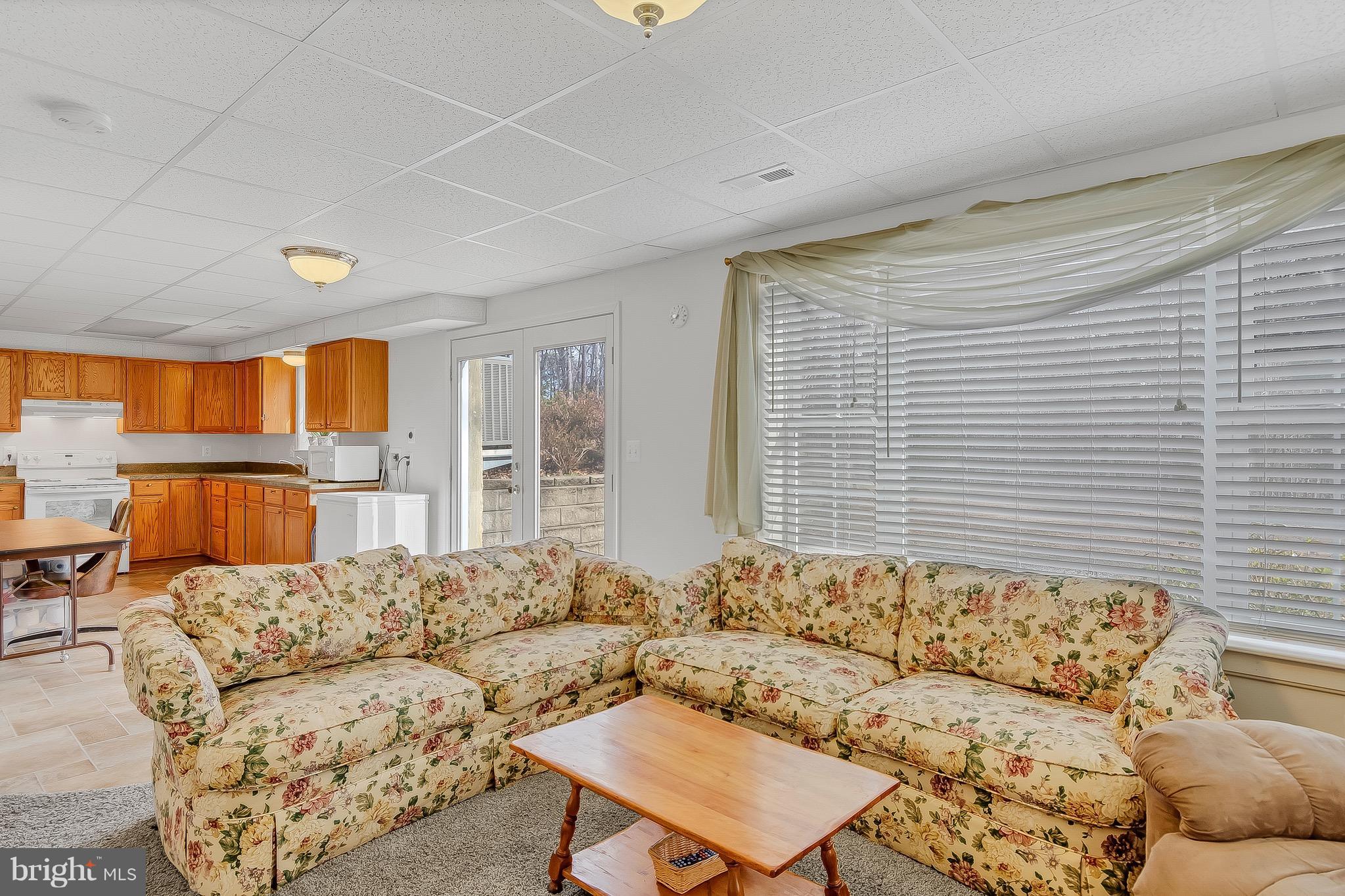10120 Mackall Road St. Leonard, MD 20685 - Photo 24 of 29 a living room with furniture and a large window