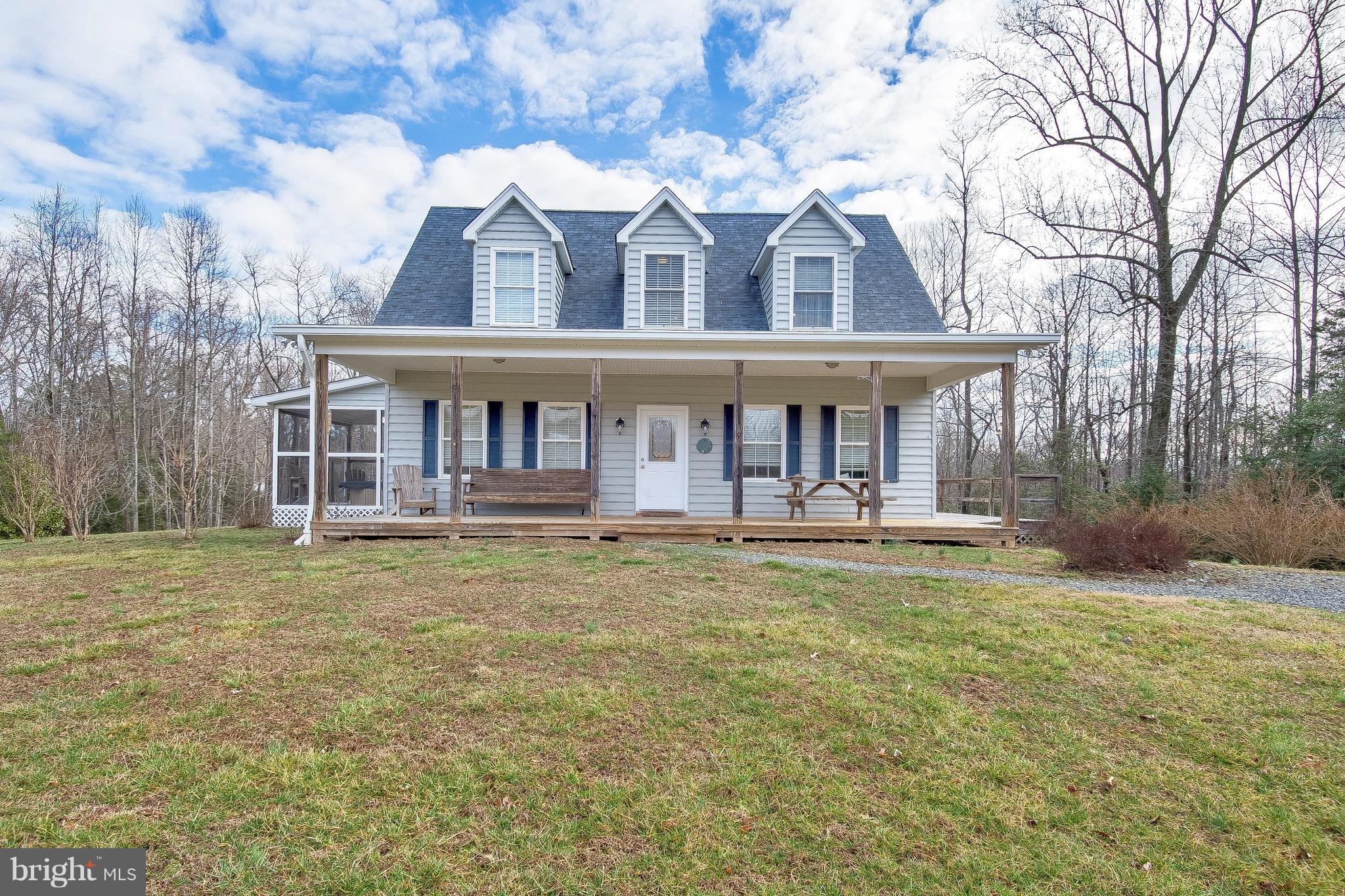 10120 Mackall Road St. Leonard, MD 20685 - Photo 10 of 29 a front view of a house with garden