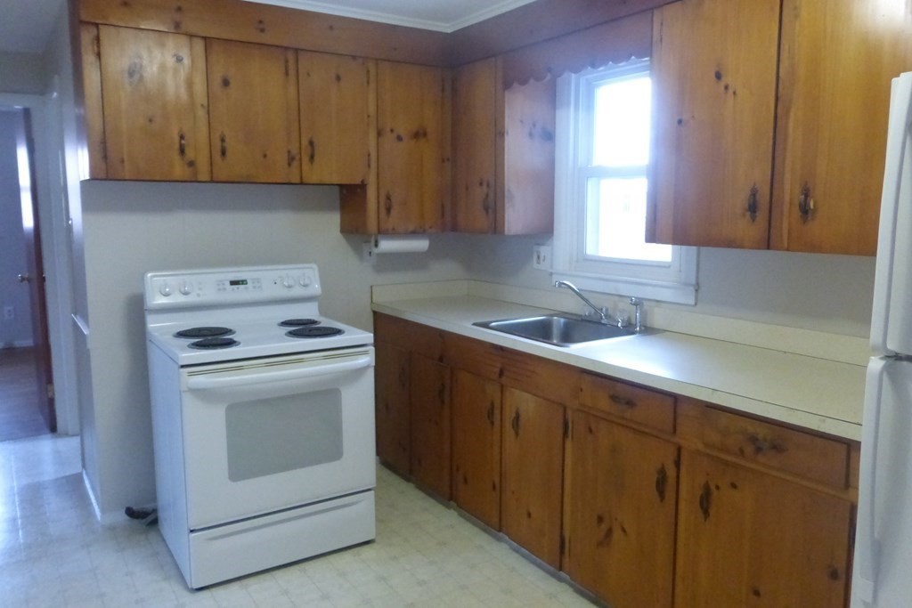 54 King Philip Road Worcester, MA 01606 - Photo 3 of 22 a kitchen with appliances cabinets and a sink
