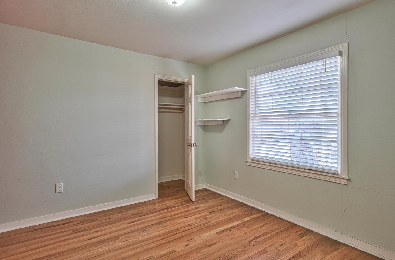 75 Mayfair Drive Salinas, CA 93905 - Photo 13 of 20 an empty room with wooden floor and windows