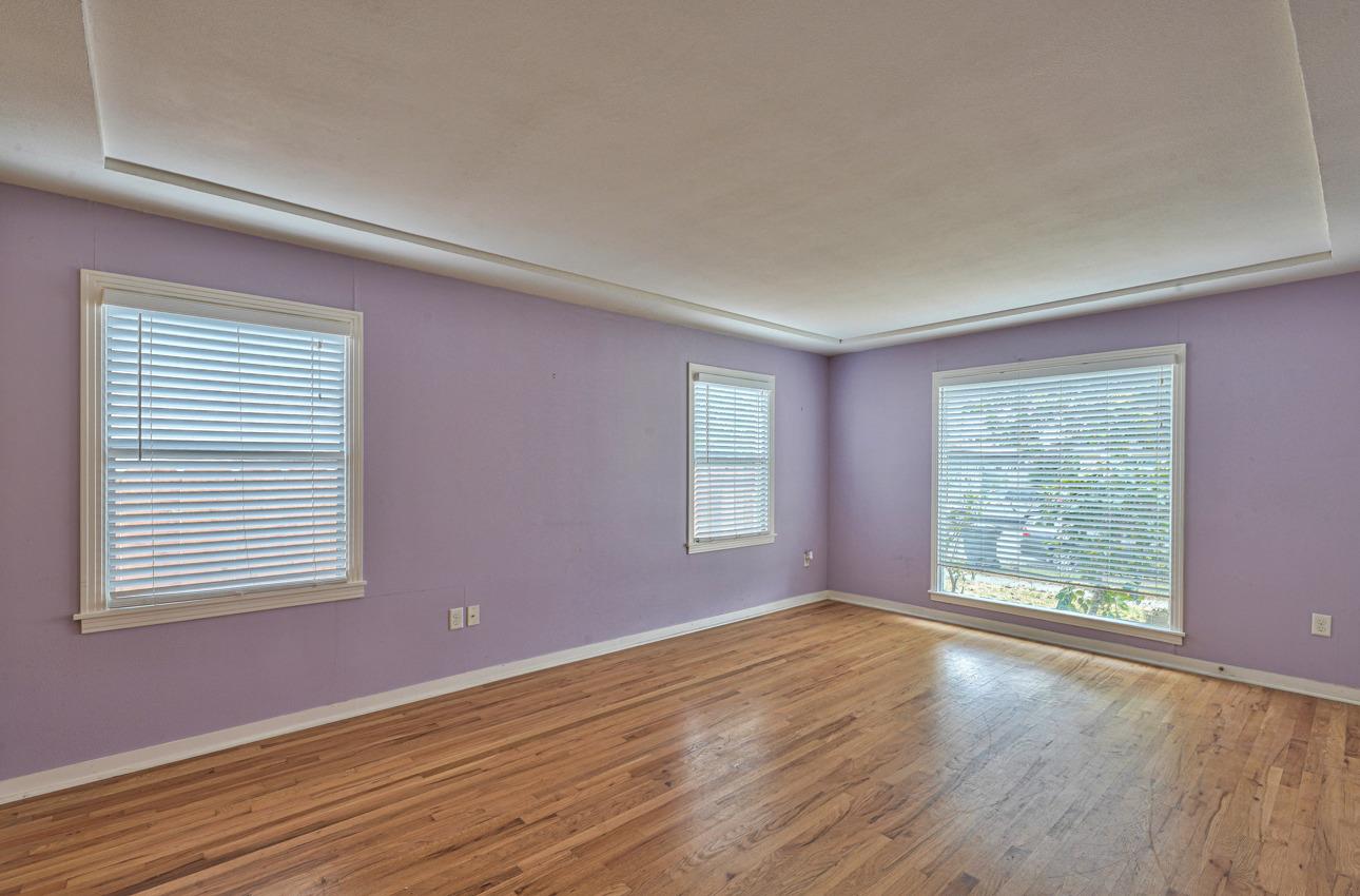 75 Mayfair Drive Salinas, CA 93905 - Photo 5 of 20 a view of an empty room with wooden floor and a window