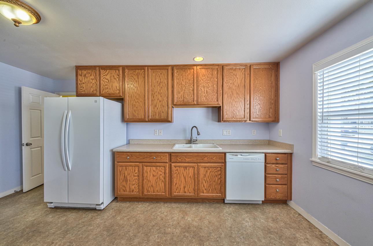 75 Mayfair Drive Salinas, CA 93905 - Photo 8 of 20 a kitchen with stainless steel appliances granite countertop a refrigerator and a sink