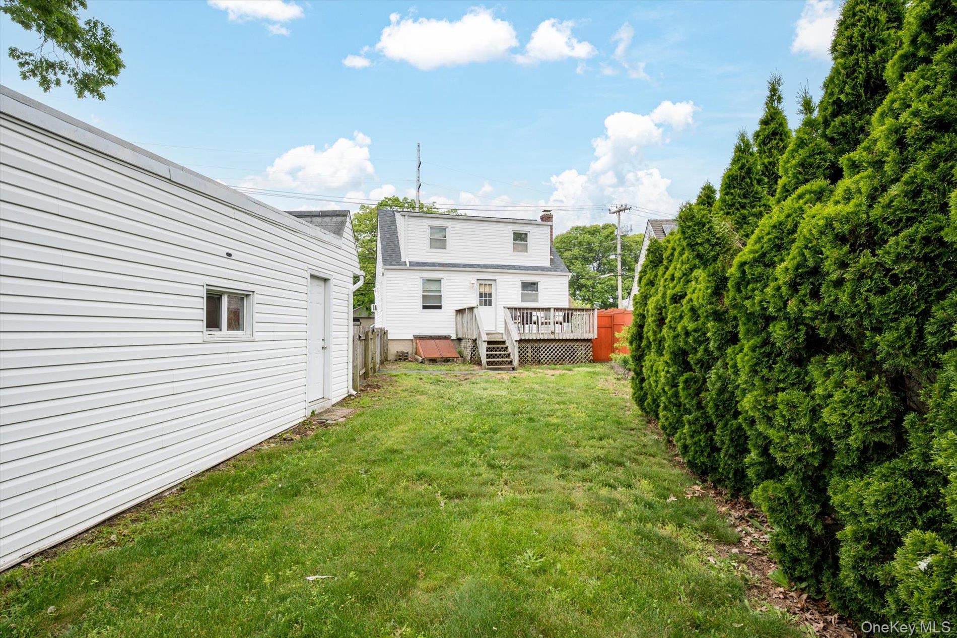 675 Little E Neck Road West Babylon, NY 11704 - Photo 18 of 20 a view of a backyard with sitting area