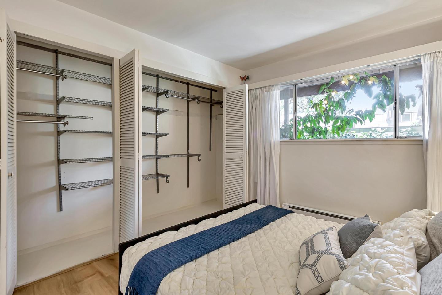 500 West Middlefield Road, Unit 71 Mountain View, CA 94043 - Photo 16 of 42 a bedroom with a bed and a window