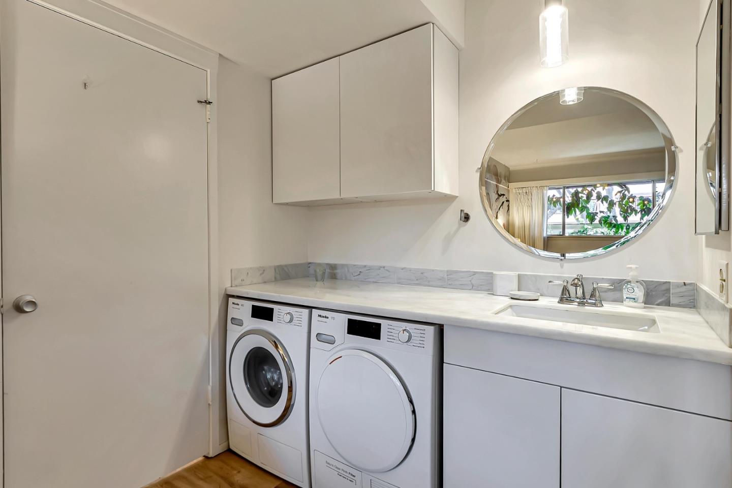 500 West Middlefield Road, Unit 71 Mountain View, CA 94043 - Photo 17 of 42 a utility room with sink dryer and washer