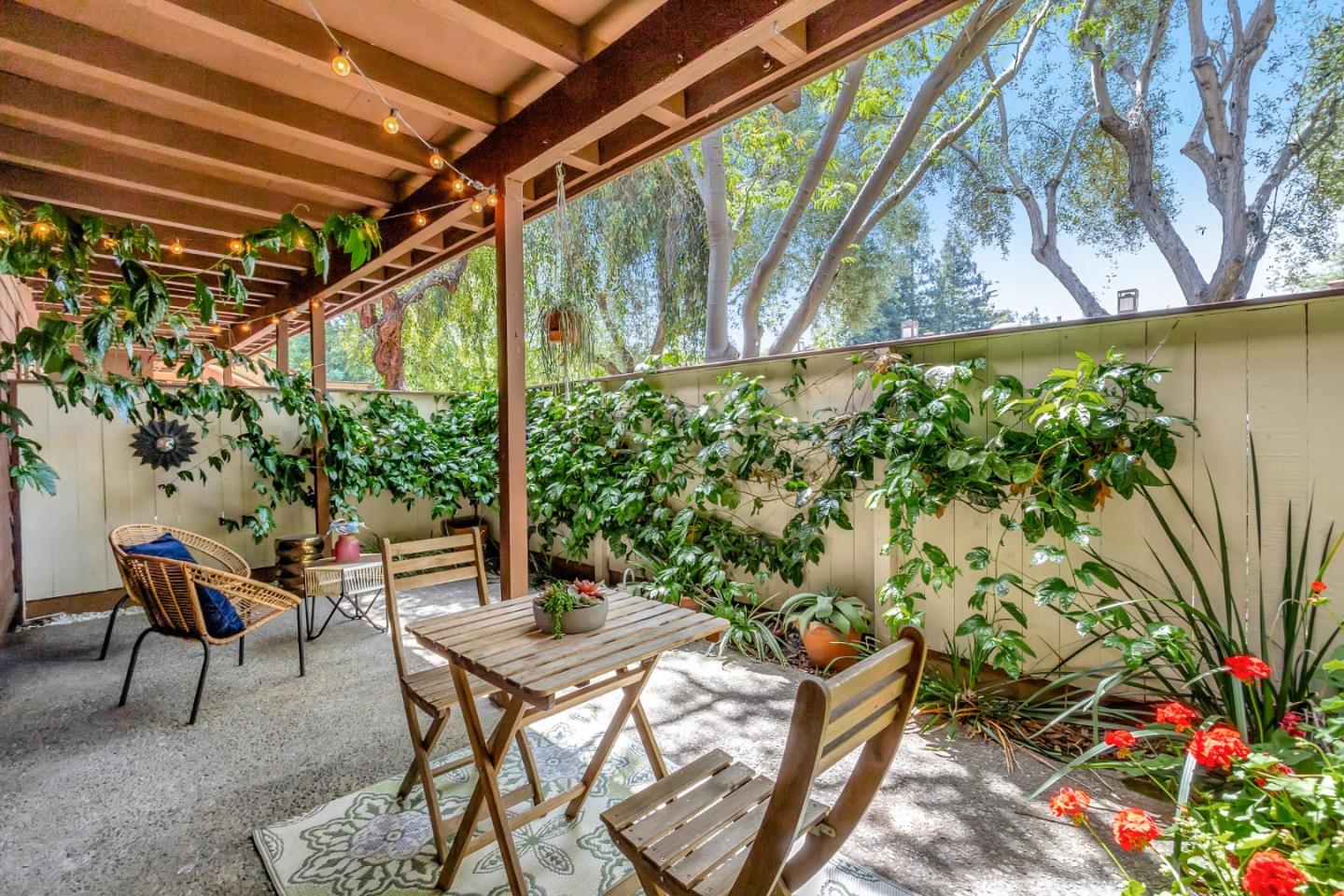 500 West Middlefield Road, Unit 71 Mountain View, CA 94043 - Photo 22 of 42 a backyard of a house with table and chairs