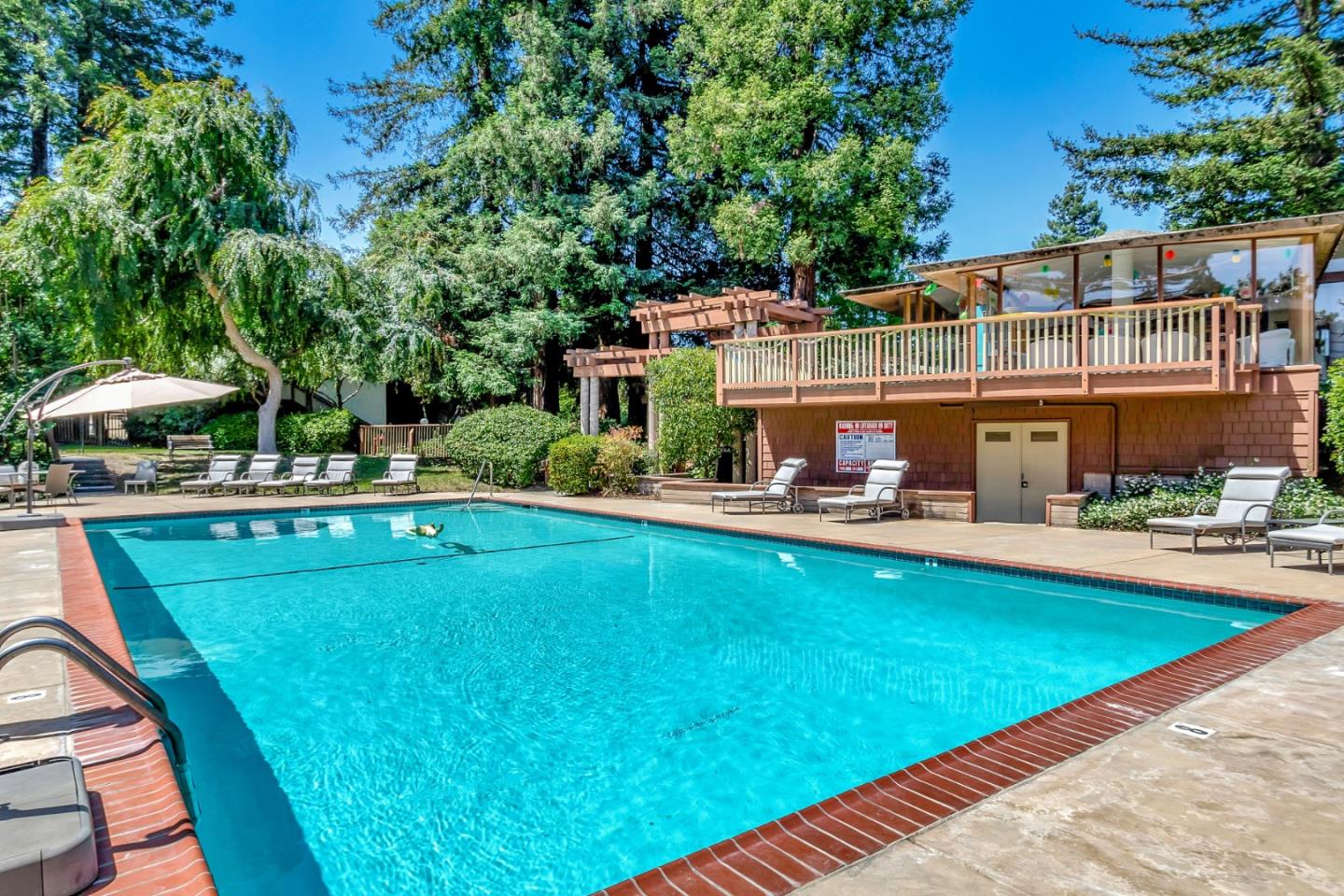 500 West Middlefield Road, Unit 71 Mountain View, CA 94043 - Photo 29 of 42 a view of an house with swimming pool and chairs
