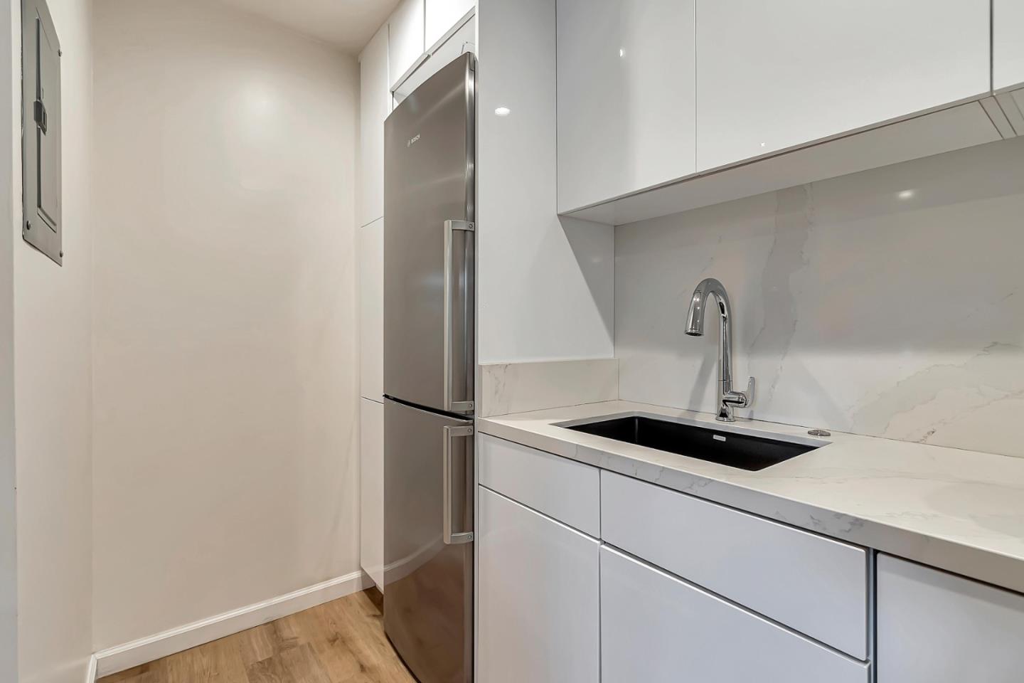500 West Middlefield Road, Unit 71 Mountain View, CA 94043 - Photo 6 of 42 a kitchen with a sink and a refrigerator