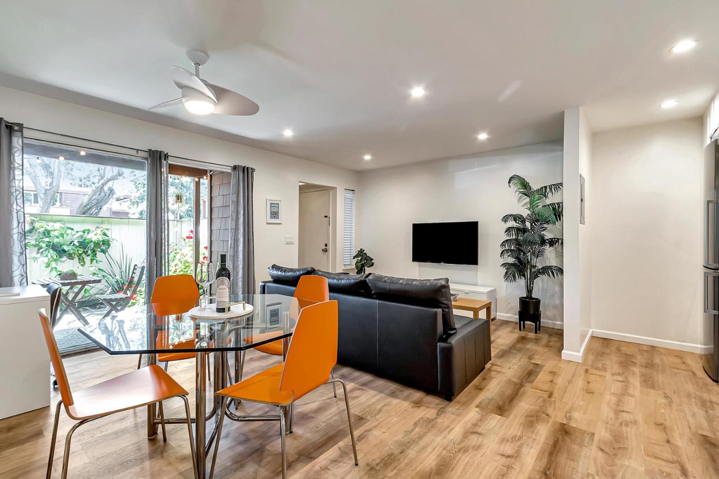 500 West Middlefield Road, Unit 71 Mountain View, CA 94043 - Photo 7 of 42 a living room with furniture and a flat screen tv