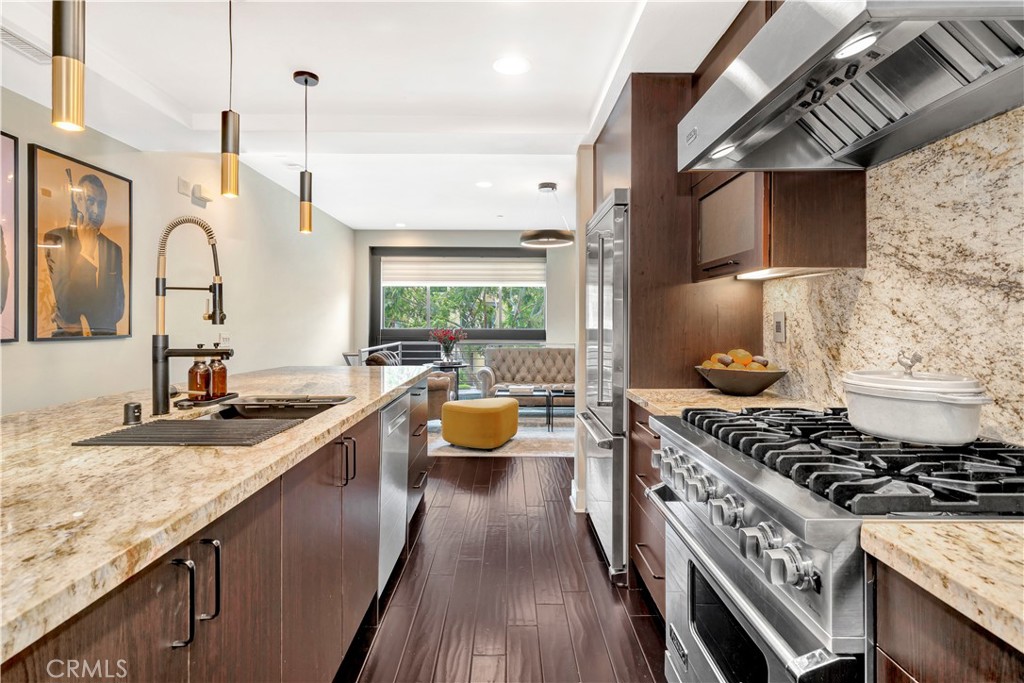 810 Rockefeller Irvine, CA 92612 - Photo 1 of 1 a kitchen with stainless steel appliances granite countertop a sink stove and refrigerator