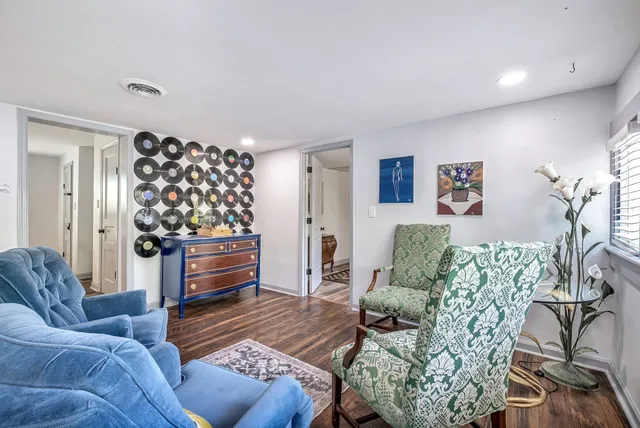 a kitchen with kitchen island granite countertop a stove a sink and wooden cabinets