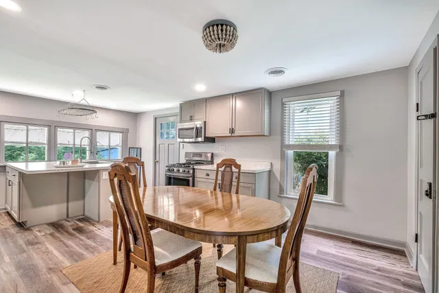 a view of a dining room with furniture window and outside view