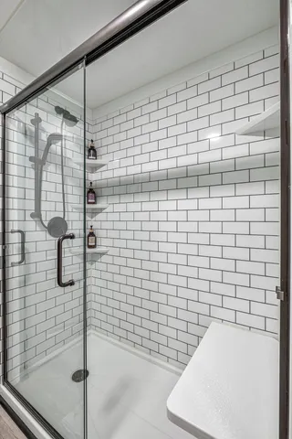 a bedroom with a bed couch and window