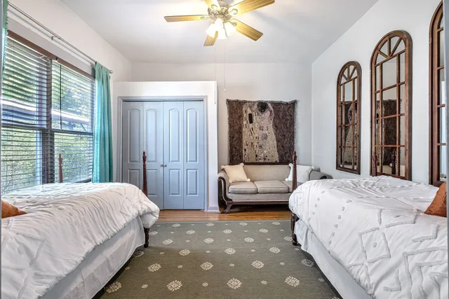 a bed room with a bed and a window