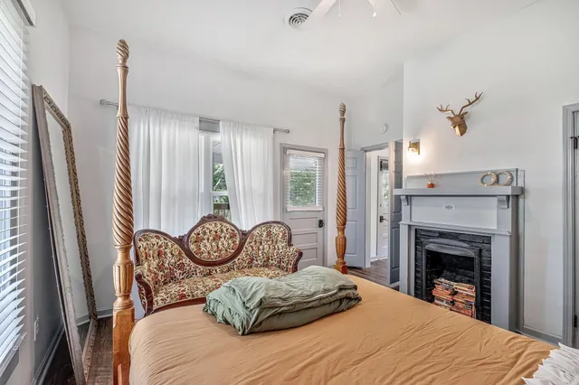 a view of a chairs and table in backyard