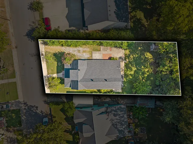 a balcony with furniture and a potted plant