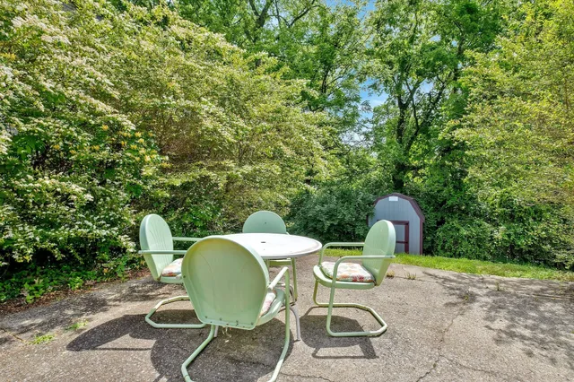 an aerial view of residential houses with outdoor space and street view