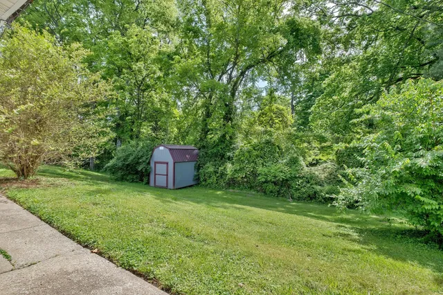 an aerial view of residential building with parking space