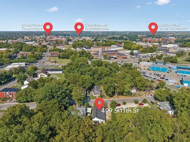 a living room with furniture a fireplace and window