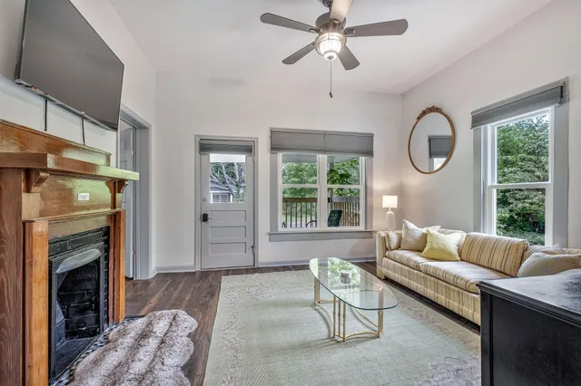 a view of room with window and wooden floor