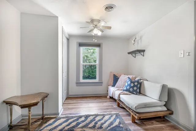 a living room with furniture and a gate