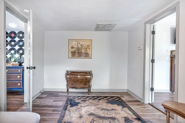 a living room with furniture and large windows