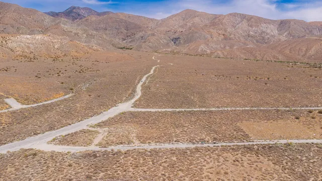a view of a dry yard with mountain