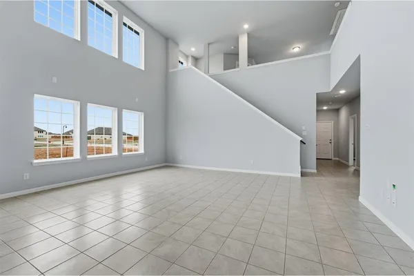 a view of an empty room with windows