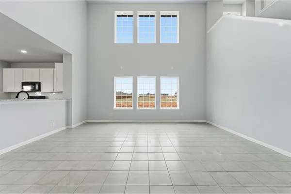 a view of a kitchen with an empty space and a window