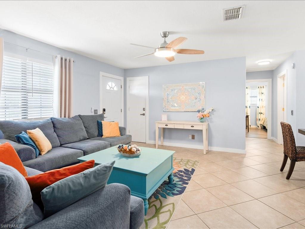 2469 Florida Avenue Naples, FL 34112 - Photo 11 of 31 Living area featuring tile patterned flooring and ceiling fan