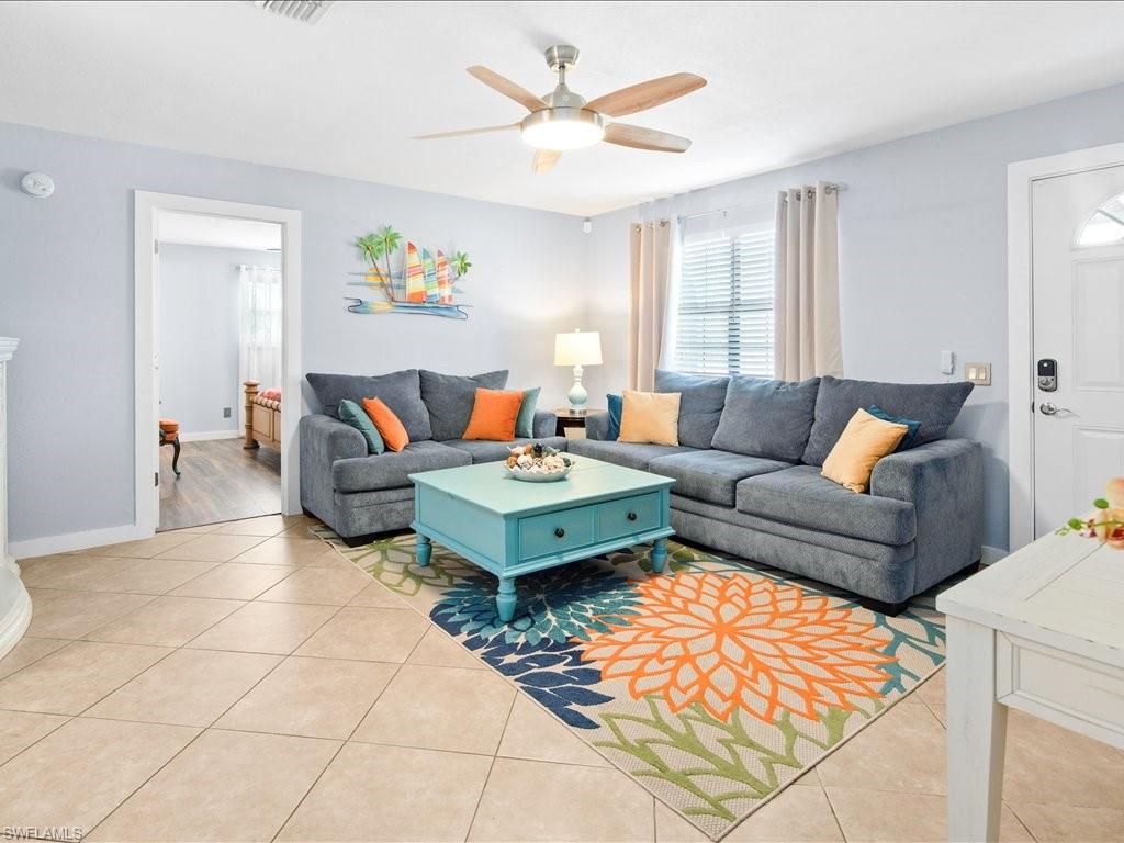 2469 Florida Avenue Naples, FL 34112 - Photo 13 of 31 Living area with light tile patterned floors and ceiling fan