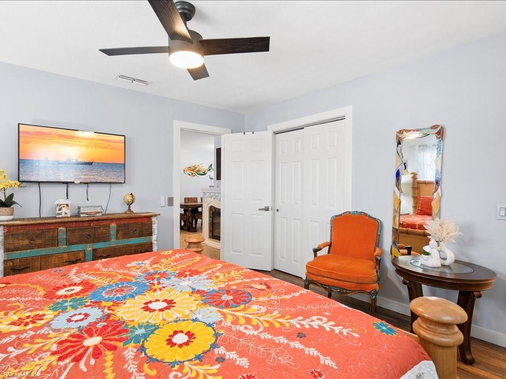 2469 Florida Avenue Naples, FL 34112 - Photo 19 of 31 Bedroom featuring ceiling fan, wood finished floors, and a closet