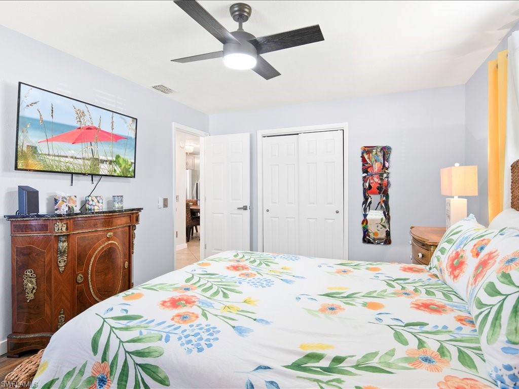 2469 Florida Avenue Naples, FL 34112 - Photo 23 of 31 Bedroom featuring ceiling fan and a closet