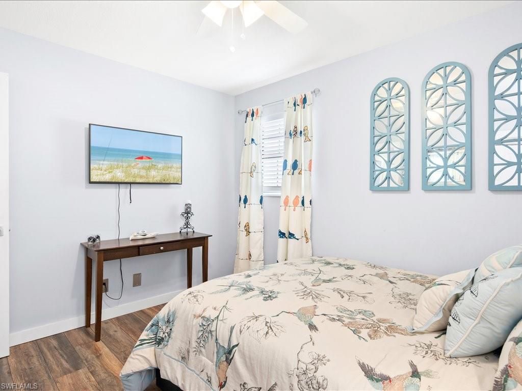 2469 Florida Avenue Naples, FL 34112 - Photo 27 of 31 Bedroom with dark wood-style flooring and a ceiling fan