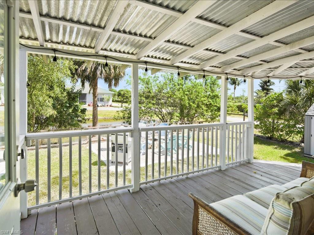 2469 Florida Avenue Naples, FL 34112 - Photo 28 of 31 Wooden terrace with a lawn