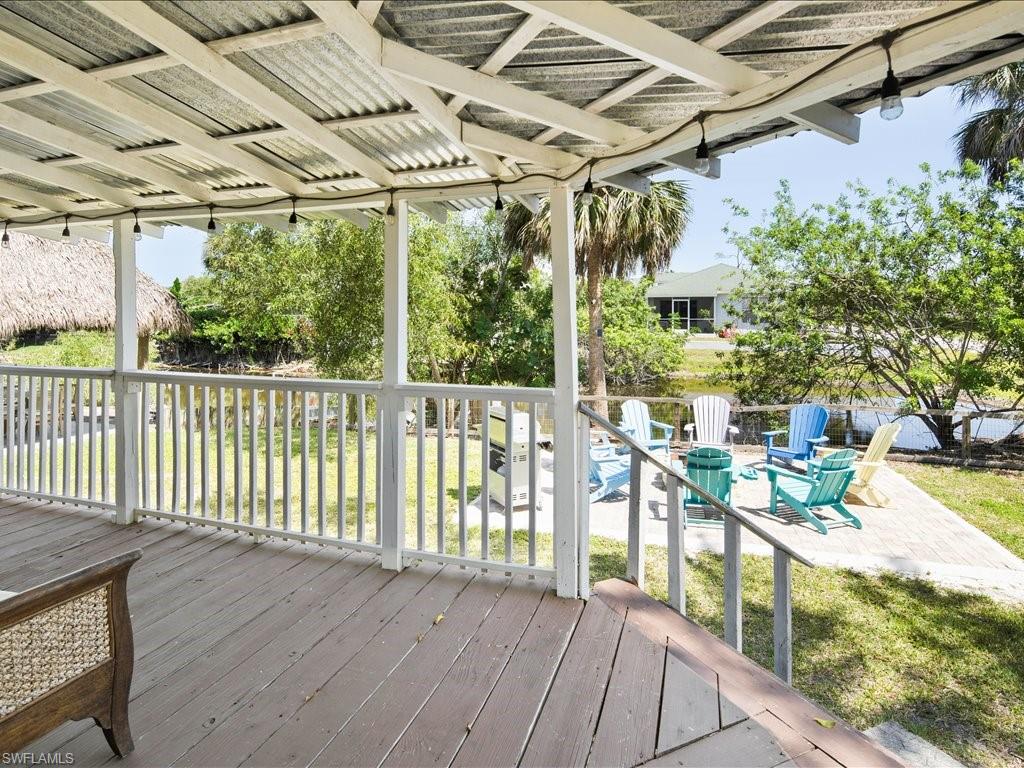 2469 Florida Avenue Naples, FL 34112 - Photo 31 of 31 Wooden deck with a yard and a patio