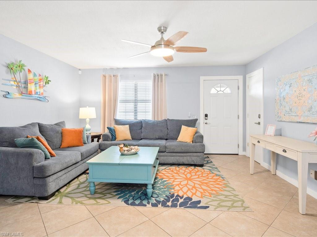 2469 Florida Avenue Naples, FL 34112 - Photo 10 of 31 Living room with light tile patterned floors and ceiling fan