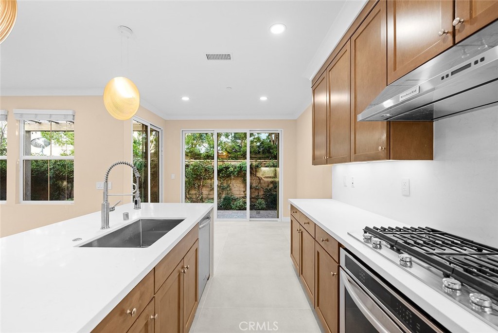 143 Rodeo Irvine, CA 92602 - Photo 4 of 37 a kitchen that has a sink and a stove