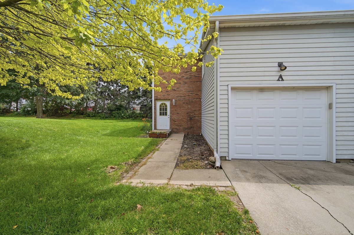 1532 Hunt Drive, Unit A Normal, IL 61761 - Photo 1 of 25 a front view of a house with a yard
